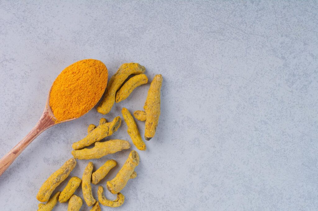 Whole dried turmeric fingers close view